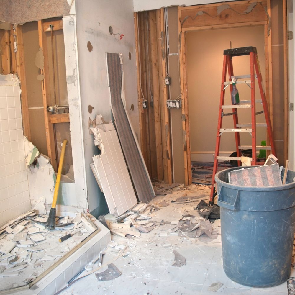 Professional demolition team dismantling a residential interior
